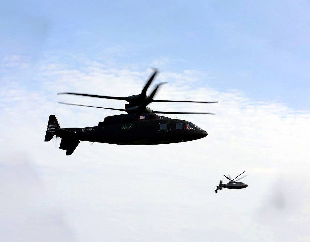 The Sikorsky-Boeing SB>1 Defiant (left) and its smaller X2 cousin, the S-97 Raider, over West Palm Beach, Florida, during a demonstration of formation flight in August. Lockheed Martin Photo