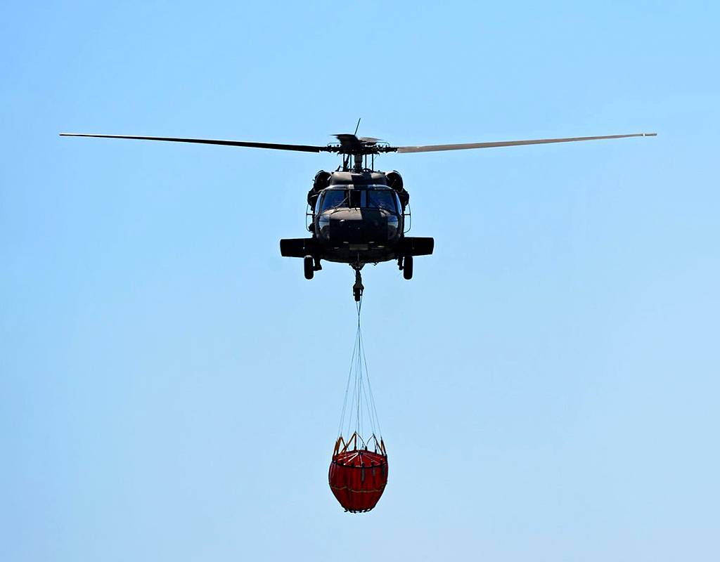 New York Army National Guard UH-60 Black Hawk helicopter crews conduct water bucket training at Round Lake on May 13, 2020. Eric Durr Photo