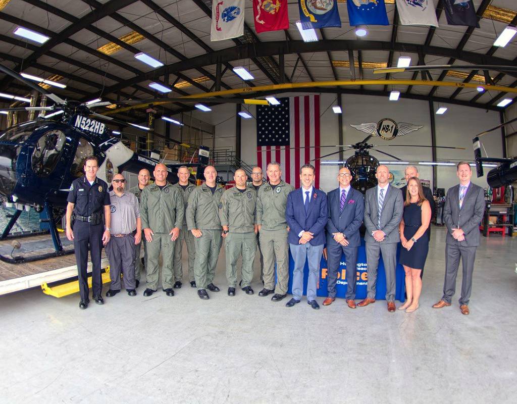 MDHI executives gather with Huntington Beach Police Department to sign a purchase agreement for three new MD 530Fs. MDHI Photo