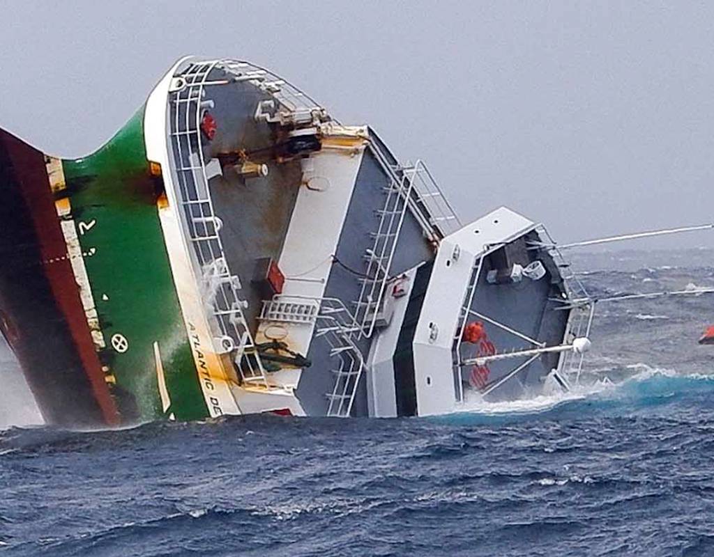 The bow of the doomed Atlantic Destiny fishing vessel points skyward as the ship sinks into the Atlantic Ocean.