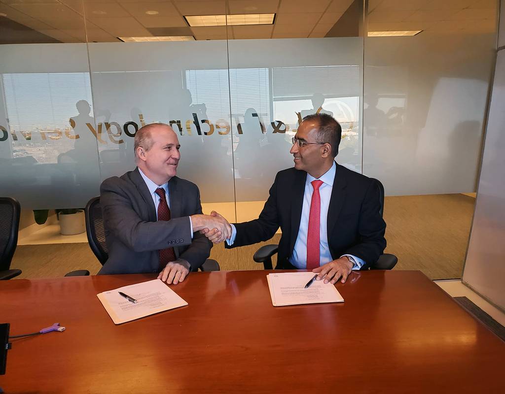 Martin Peryea, CEO (left) of Jaunt Air Mobility signs an agreement with Amit Chadha, CEO of LTTS (right). Jaunt announced today the company would be working with L&T Technology Services Limited as an essential engineering partner on the Jaunt Journey eVTOL (electric vertical takeoff and landing) air taxi. Business Wire Photo