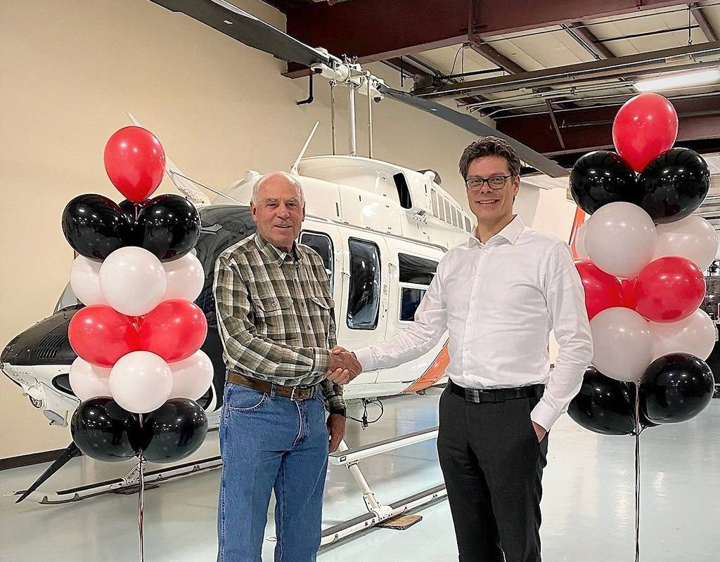 Larry Hansen, Paravaion Technology Inc and Century Helicopters Inc. (left) with Alain Madore, president and CEO DART Aerospace. DART Photo