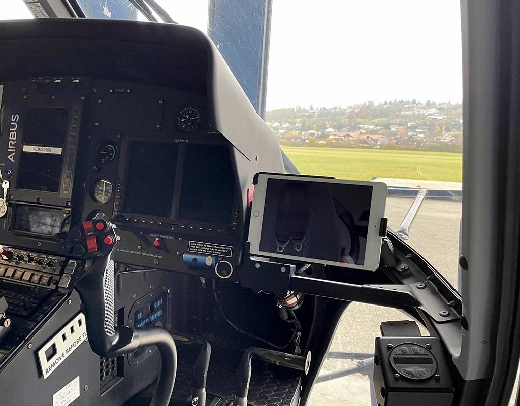 The EFB mount is shown installed on the right-hand side of the instrument panel holding an iPad Mini. Heli Solutions Photo