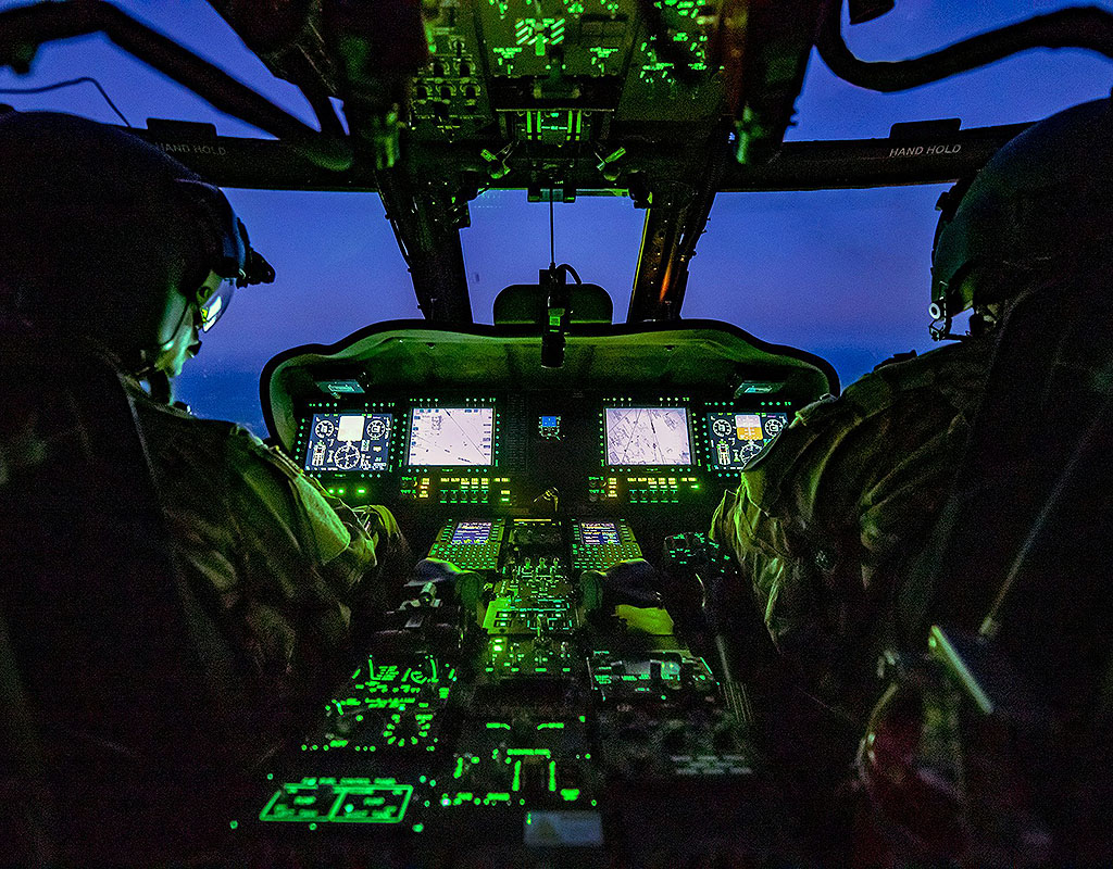 While also preparing for an upcoming deployment, aviators with the 106th Aviation Regiment, Illinois Army National Guard, operate inside the cockpit during an operational test of the UH–60V Blackhawk helicopter at Fort McCoy, Wisconsin. Mark Scovell, U.S. Army Operational Test Command Photo