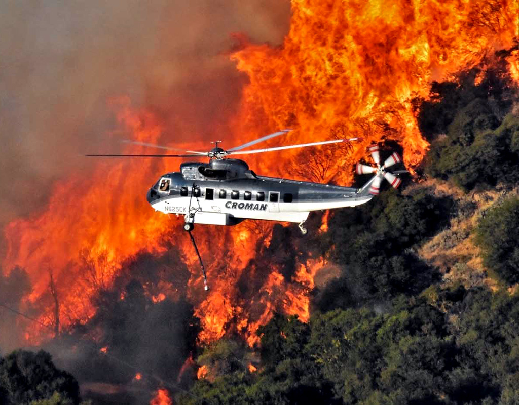 Wildfire seasons seem to be getting longer and longer in the U.S. Here a Croman Sikorsky S-61N battles a blaze. Jeremy Ulloa Photo
