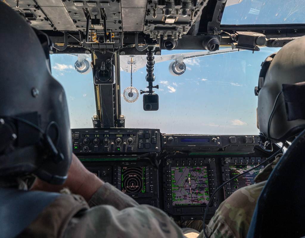 A CV-22 Osprey tiltrotor aircraft assigned to the 20th Special Operations Squadron and a KC-46 Pegasus tanker aircraft assigned to the 349th Air Refueling Squadron conduct the first ever in-air refueling operation between the two aircraft over Cannon Air Force Base, New Mexico, June 1, 2022. Staff Sgt. Max J. Daigle for U.S. Air Force Photo