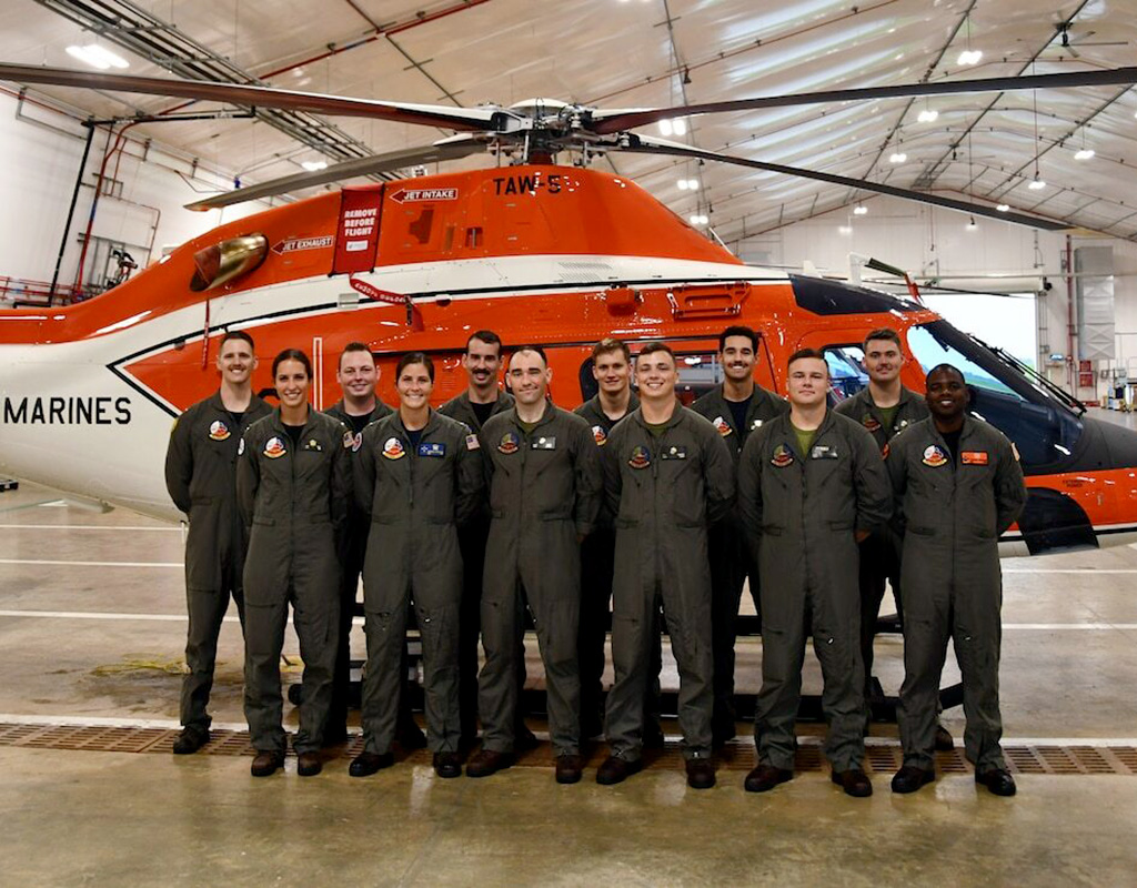 Training Air Wing Five’s first 12 student naval aviators to begin training in the new TH-73A Thrasher helicopter stand in front of one of the aircraft. Lt.j.g. Nelson Chandler for NAS Whiting Field Public Affairs Photo