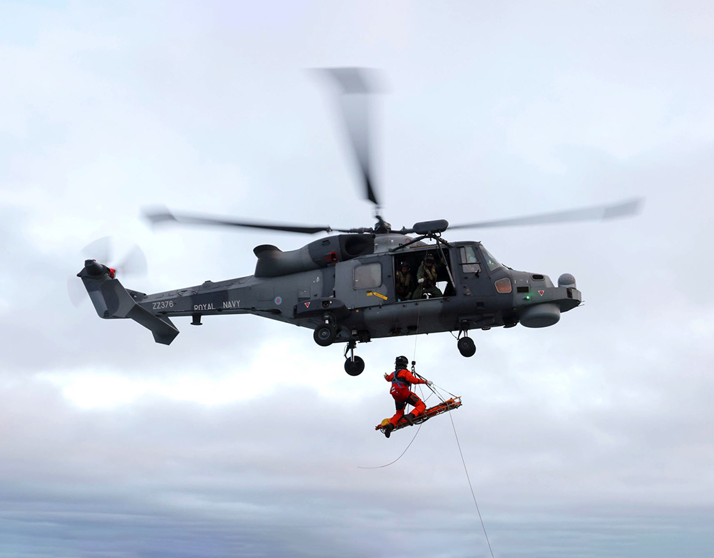 British Armed Forces conducting winching drills with a Wildcat helicopter. Crown Copyright Photo