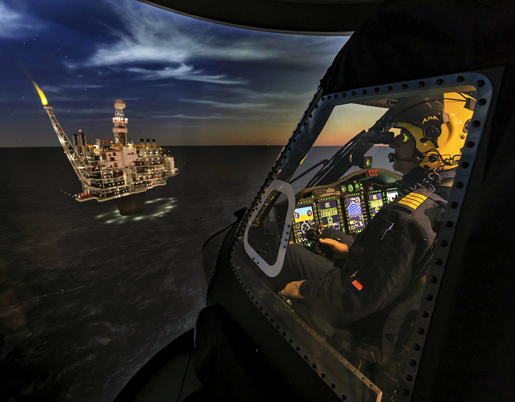 A pilot performs an offshore training mission in a Sikorsky S-92 Level D full flight simulator using night vision goggles. Heath Moffatt Photo