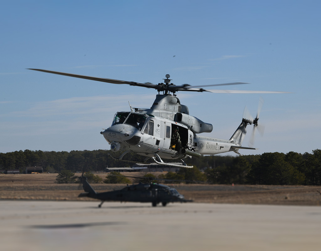 A U.S. Marine Corps UH-1Y Venom assigned to Marine Light Attack Helicopter Squadron 773 from Marine Aircraft Group 49, takes off during a training exercise alongside an HH-60G Pave Hawk. U.S. Air National Guard photo by Airman First Class Sarah McKernan.
