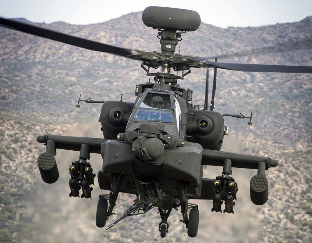 A Boeing AH-64E Apache takes part in a ground-to-air shoot in the Arizona desert. Boeing Photo