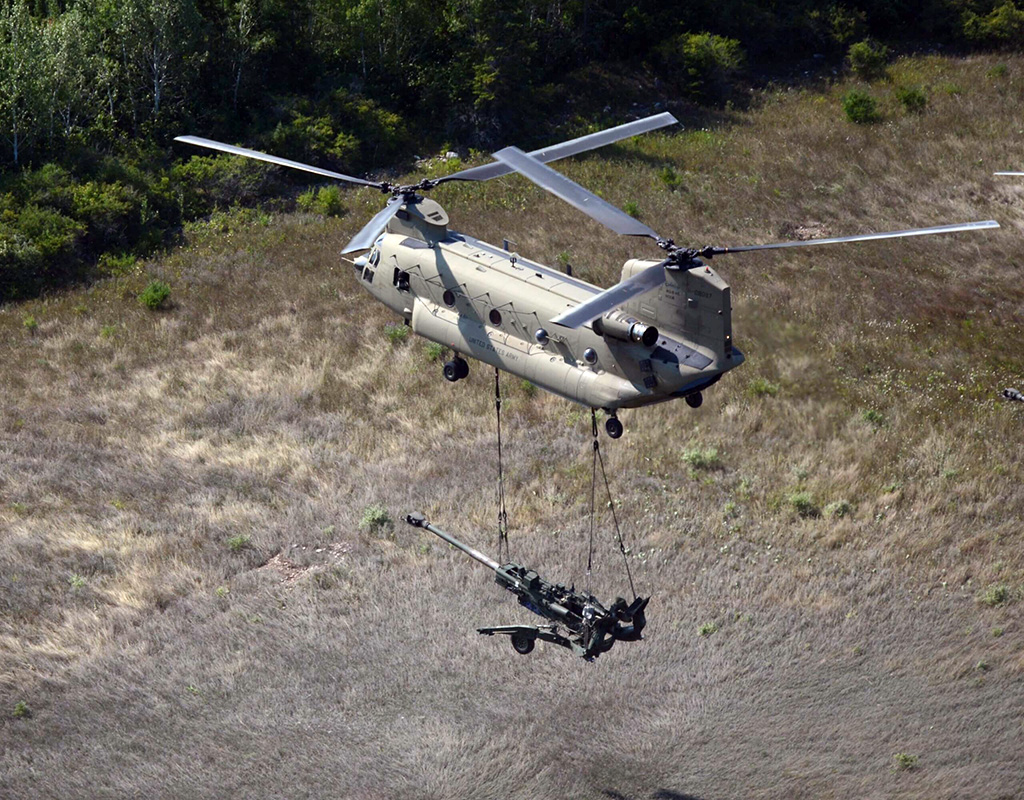 A U.S. Army CH-47F performs a sling load during a training exercise. Fred Troilo/Boeing Photo