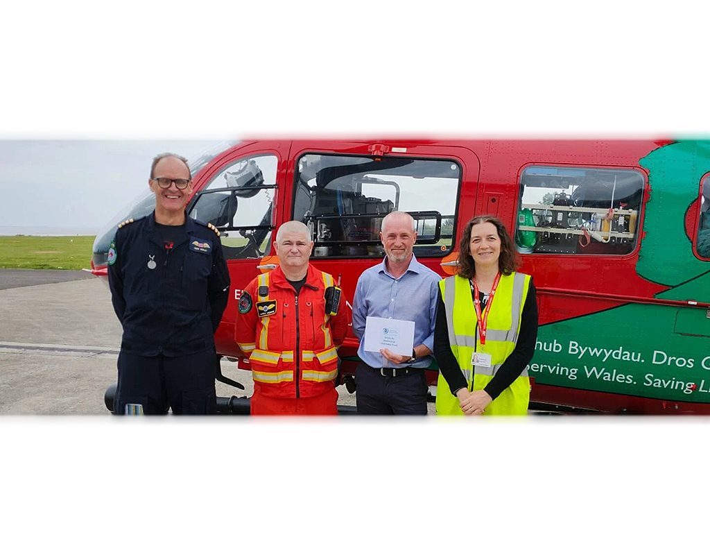 The Hospital Saturday Fund presented a grant to the lifesaving air ambulance charity to buy search-and-rescue Alpha 900 helmets for the crew. Wales Air Ambulance Photo