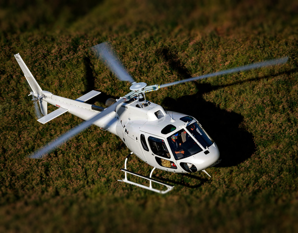 An Airbus H125 helicopter, in flight. Airbus Helicopters Photo