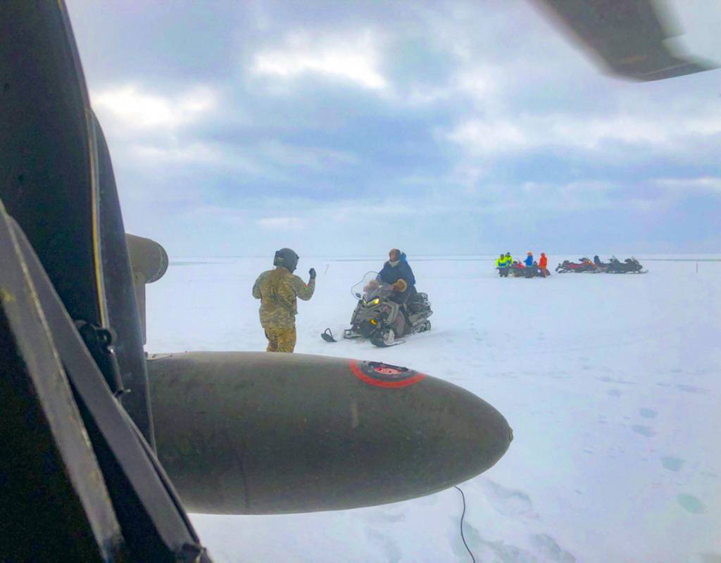 An Alaska Army National Guard UH-60 Black Hawk helicopter aircrew perform a search-and-rescue mission for three Iditarod mushers about 25 miles east of Nome. National Guard Courtesy Photo