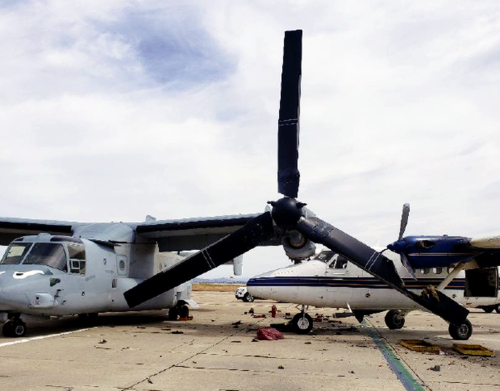 The parked MV-22B Osprey that was impacted by an occupied Twin Otter aircraft had damage to its left wing, engine and propeller blade. City of San Diego Photo