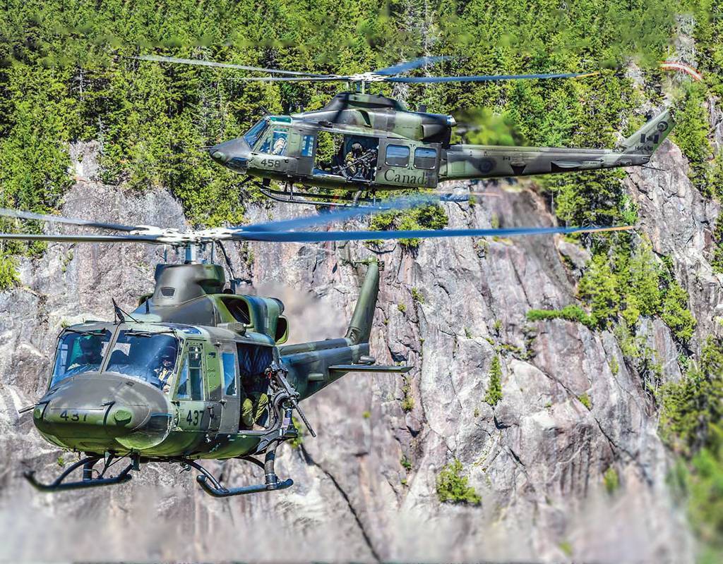 The CH-146 Griffons are equipped with standard protection such as the C6, GAU 21 or Dillon M134 machine guns.. Mike Reyno Photo