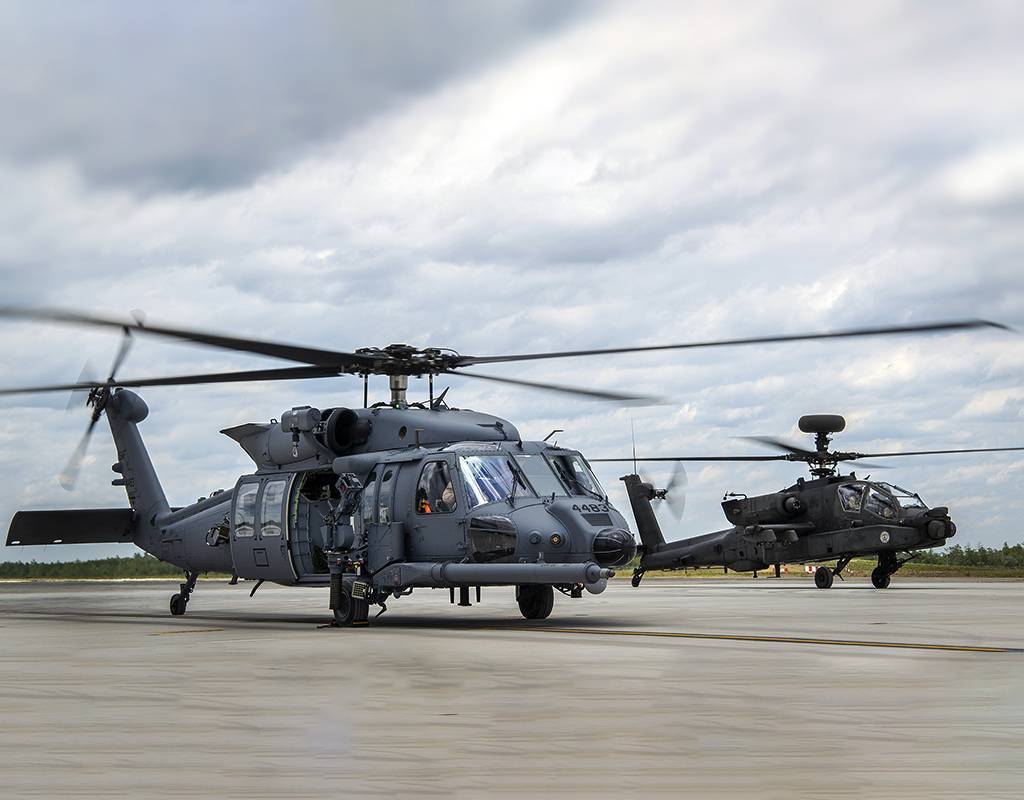 An HH-60W Jolly Green II taxies in followed by an AH-64 Apache on May 19 at Eglin Air Force Base, Florida. U.S. Air Force/Samuel King Jr. Photo