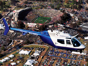Every year on Jan. 1, Pasadena Air Ops flies multiple missions for the Tournament of Roses Parade and Rose Bowl. Here, a Bell OH-58A does an overflight of the Rose Bowl. Skip Robinson Photo