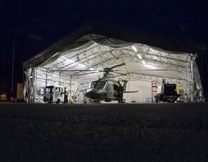 The National Ambulance Service Leonardo AW139 crew conducts pre-flight checks in Custume Barracks. NAS Photo