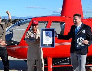 Captain Ric Webb CEO of Eco Helicopters receiving the award for setting the world record for longest electric powered helicopter flight, with Martine Rothblatt and Glen Dromgoole. Eco Helicopters Photo