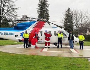 Santa and his entourage including Helijet president and CEO Danny Sitnam and BCEHS paramedic Jeff Scott personally flew the first round of gifts directly to the hospital helipad outside BC Children’s Hospital for pickup. Helijet Photo