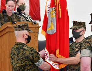 Col. David C. Walsh, left, transfers leadership of the U.S. Marine Corps H-1 Light/Attack Helicopters program office (PMA-276) to Col. Vasilios E. Pappas, right, during a change of command ceremony Mar. 25 at Naval Air Station Patuxent River, Md. U.S. Navy Photo by Joy Shrum