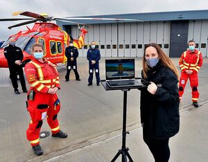 EHAAT CEO Jane Gurney took possession of EHAAT’s brand-new purpose-built airbase from Mark Hart, joint divisional managing director of Barnes Construction, in a socially distanced handover. EHAAT Photo
