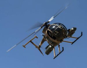 An Afghan Air Force MD 530F Cayuse Warrior helicopter maneuvers for another gun-run, during a media demonstration, in April 2015, at a training range outside of Kabul, Afghanistan. SSGT Perry Aston Photo