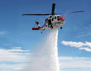 A Cal Fire Hawk demonstrates its ability to drop a concentrated plume of water from its 3,785-liter (1,000-gallon) external water tank. United Rotorcraft Photo