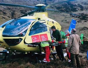 SCAA landed on the hillside, 200 meters below the patient, and paramedics worked with two mountain rescue team members to stretcher the injured man to the helicopter. SCAA Photo