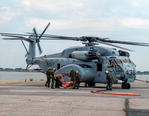 Sailors assigned to Helicopter Mine Countermeasures Squadron (HM) 12, prepare an MH-53E Sea Dragon for Bambi Bucket training. Mass Communication Specialist 3rd Class Bonnie Lindsay for U.S. Navy Photo