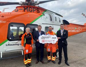 Robert Bertram, CEO of the HELP Appeal, presents cheque to Magpas Air Ambulance CEO Daryl Brown MBE and medical team. HELP Appeal Photo