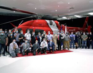 Canadian Coast Guard and Bell Textron Canada staff pose in front of the 16th Bell 429 helicopter delivered to the Coast Guard on September 15, 2021. CNW Group/Canadian Coast Guard Photo