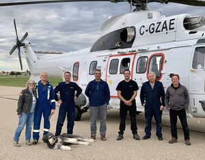 The Questral team poses alongside the Airbus AS332 L2 Super Puma after their first flight with the aircraft. Questral Helicopters Photo