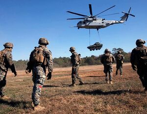 U.S. Marines with Combat Logistics Battalion 24, Combat Logistics Regiment 2, 2nd Marine Logistics Group watch a CH-53K King Stallion hover during a Helicopter Support Team operation at Tactical Landing Zone Albatross on Camp Lejeune, North Carolina, Nov. 20, 2021. Pfc. Meshaq Hylton Photo