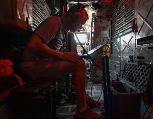 Sam Denison, a senior software developer at the 49th Test and Evaluation Squadron at Barksdale AFB, La., installs a beyond line of sight communications system, called IRIS, into a B-52 at Barksdale AFB, La., June 22, 2022. The 49th TES conducted the first aerial demonstration of the IRIS system while the 608th Air Operations Center monitored and assess the data, voice and imagery relays from the aircraft. Outerlink Photo