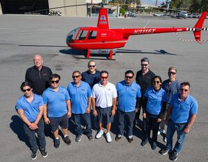 The team behind the e-R44’s landmark flight stands alongside the aircraft. Dan Megna Photo