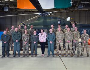 The 20th Air Force team of pilots, flight engineers and security forces members pose for a group photo with the Irish Air Corps (IAC) leaders and Ambassador Claire Cronin, U.S. ambassador to Ireland, Nov. 2, 2022, at Casement Aerodrome in Baldonnel, Ireland. 1st Lt. Emily Seaton Photo