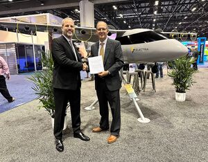 Marc Ausman, Electra chief product officer (left), and Welojets founder Alfredo Lisdero sign LOI agreement at NBAA-BACE, Oct 18, 2022. Electra Photo