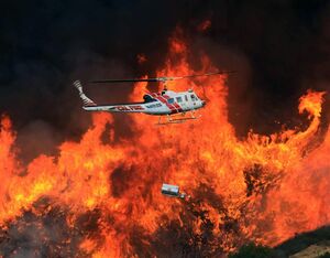 A Bell UH-1H Super Huey, mounted with an aerial tool known as a helitorth that’s used for prescribed burns. Michael Darcy Photo