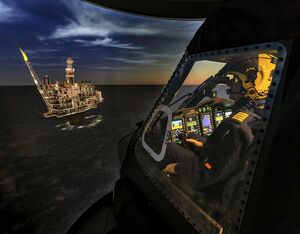 A pilot performs an offshore training mission in a Sikorsky S-92 Level D full flight simulator using night vision goggles. Heath Moffatt Photo