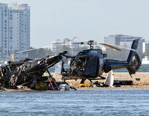The wreckage of two EC130 B4s following a collision near Seaworld, on the Gold Coast, Australia, on Jan. 2, 2023. AAP Image/Dave Hunt