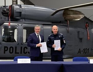 Janusz Zakrecki, PZL Mielec president and general director, stands with Polish National Police commander-in-chief gen. insp. Jarosław Szymczyk after finalizing a contract for two additional S-70i Black Hawk helicopters on Dec. 9, 2022. Lockheed Martin Photo