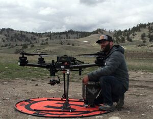 Dusty Kavitz, an Unmanned Aerial Systems program manager with the Rocky Mountain Region of the U.S. Forest Service, demonsrates how to put together an Alta-X drone on Wednesday, May 10. The Alta-X can be used to light backburns during wildfires using the "Igneous" device Kavitz is holding.