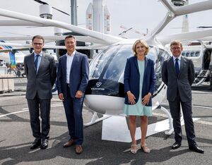 From left are Damien Cazé, director general of Civil Aviation, Dirk Hoke, CEO of Volocopter, Valérie Précresse, présidente de la Region Ilê-de-France; Edward Awkwright, Groupe ADP deputy CEO in front of a VoloCity aircraft at the 2023 Paris Air Show. Volocopter Photo