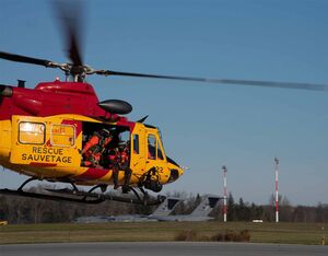 A SAR aircrew in a CH-146 Griffon lifts off for a training flight from 424 Transport and Rescue Squadron. Crews are often tasked while airborne to respond to an emergency. Chris Thatcher Photo