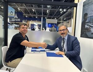 Mr. Yannick Erbs, Founder & CEO of EVFLY (on the left) and Mr. Efgan Dengür, Division CEO – Aviation / Aviation Division of YAS Holding LLC (on the right) signing MoU - EVFLY Photo