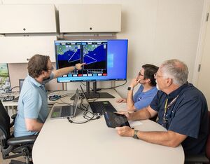 NASA lead software developer, Ethan Williams, left, pilot Scott Howe, and operations test consultant Jan Scofield run a flight path management software simulation at NASA’s Armstrong Flight Research Center in Edwards, California. Credit: NASA