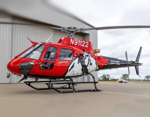 The aircraft has been transformed, from its original factory green color to a custom-designed red exterior with a mountainscape paint scheme. EuroTec Photo
